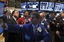 Traders work on the floor of the New York Stock Exchange